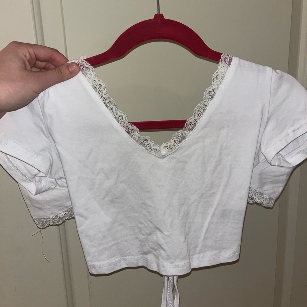 Lace shirt, ties cross cross with open back